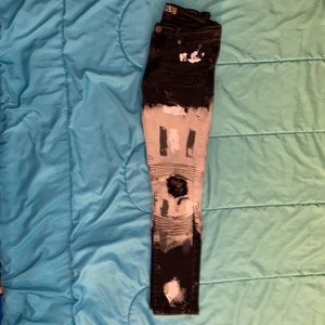 Boy size black and gray paint covered design jeans
